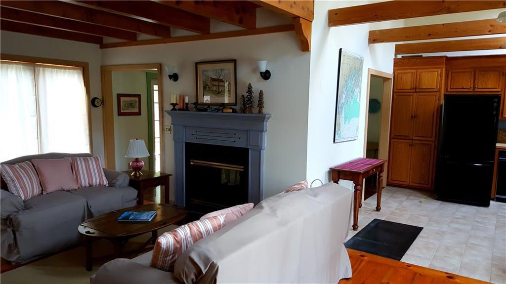 40 Old Cart Road Chebeague Island, ME 04017 - Photo 9 of 34 Living room with fireplace