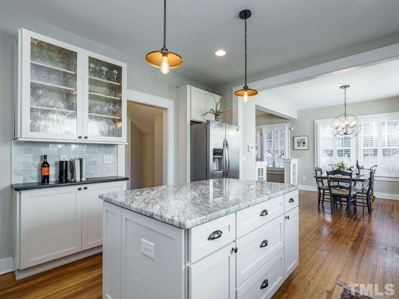 525 Euclid Street Raleigh, NC 27604 - Photo 14 of 30 a kitchen with sink cabinets and dining table