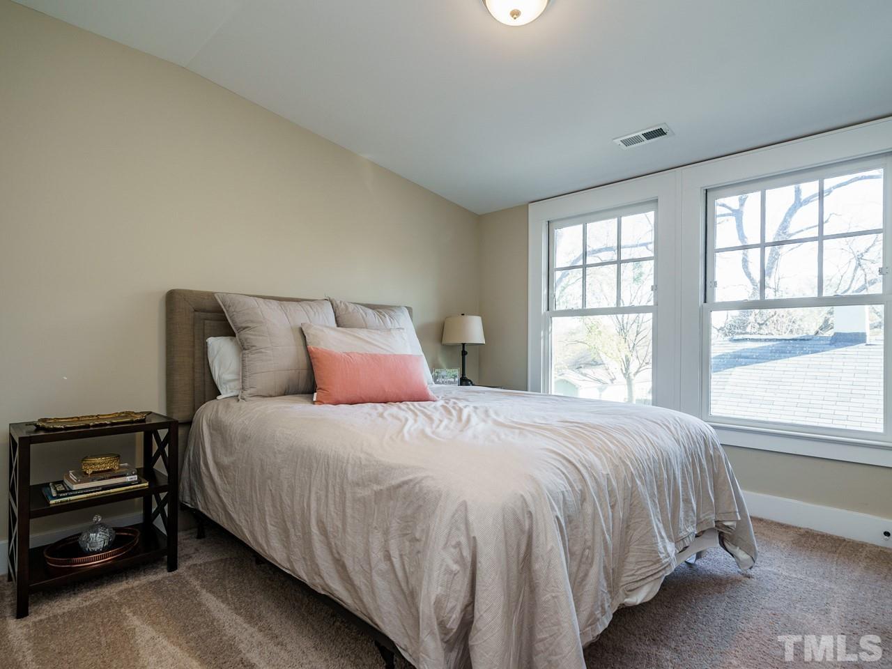 525 Euclid Street Raleigh, NC 27604 - Photo 22 of 30 a bedroom with a bed and a window