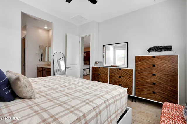 a bedroom with a bed and a dresser