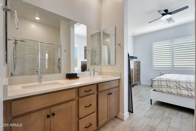 a spacious bathroom with a double vanity sink mirror and double