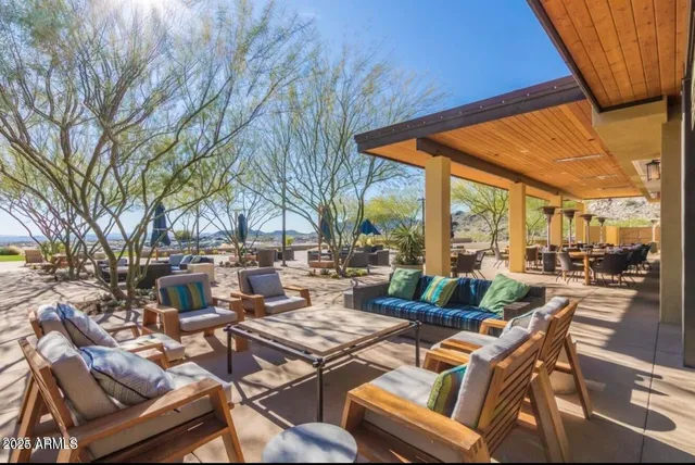 a view of a patio with couches table and chairs