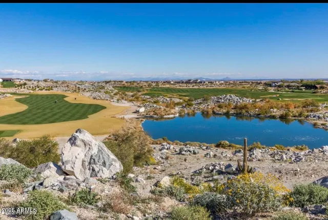 an aerial view of a house with a lake view