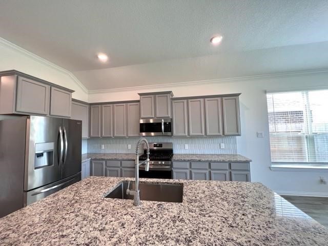 4826 Albany Ridge Lane Rosharon, TX 77583 - Photo 14 of 37 a kitchen with granite countertop a refrigerator and a stove top oven