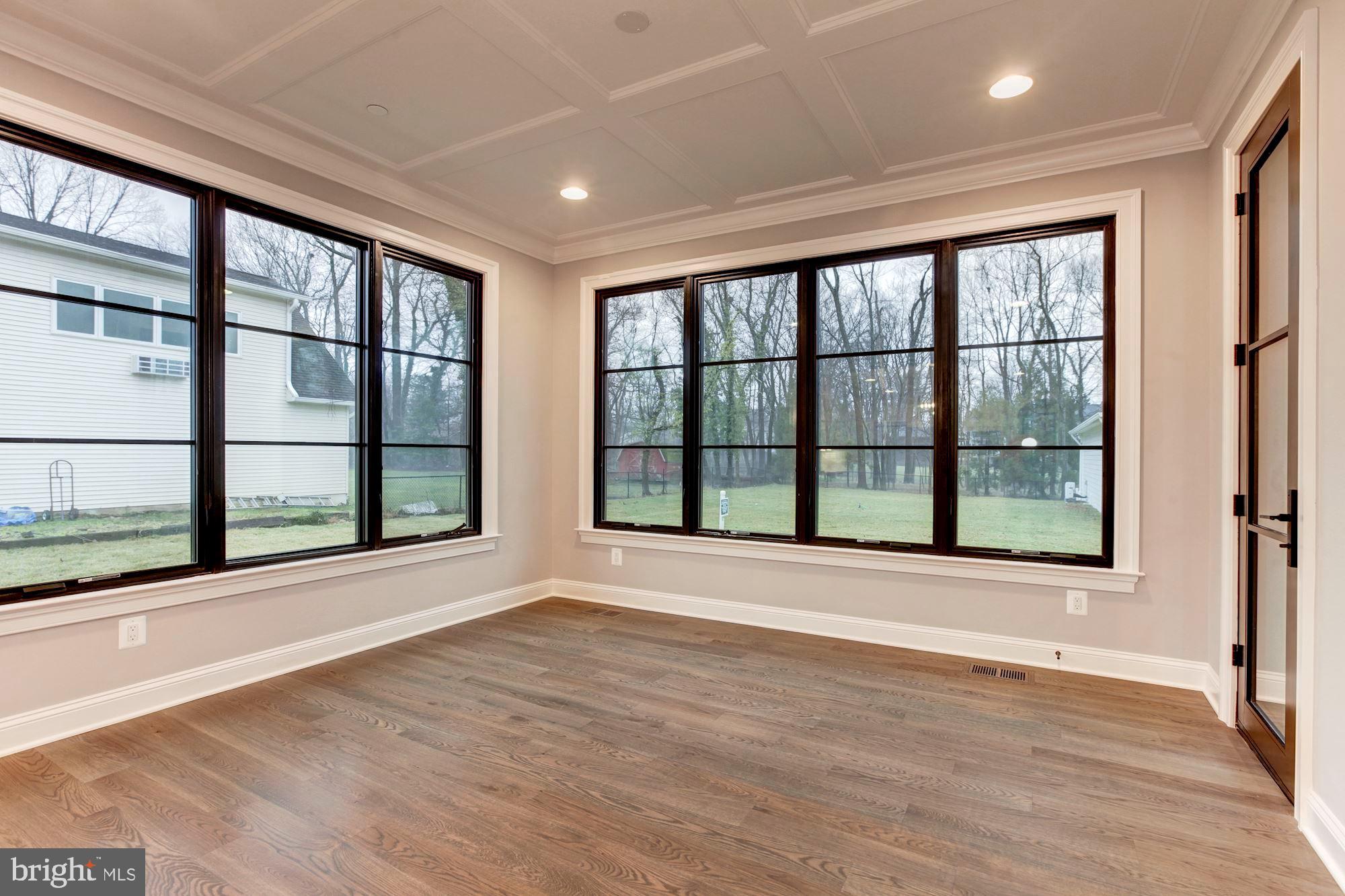 1601 Wrightson Drive McLean, VA 22101 - Photo 103 of 112 a view of an empty room with wooden floor and a window