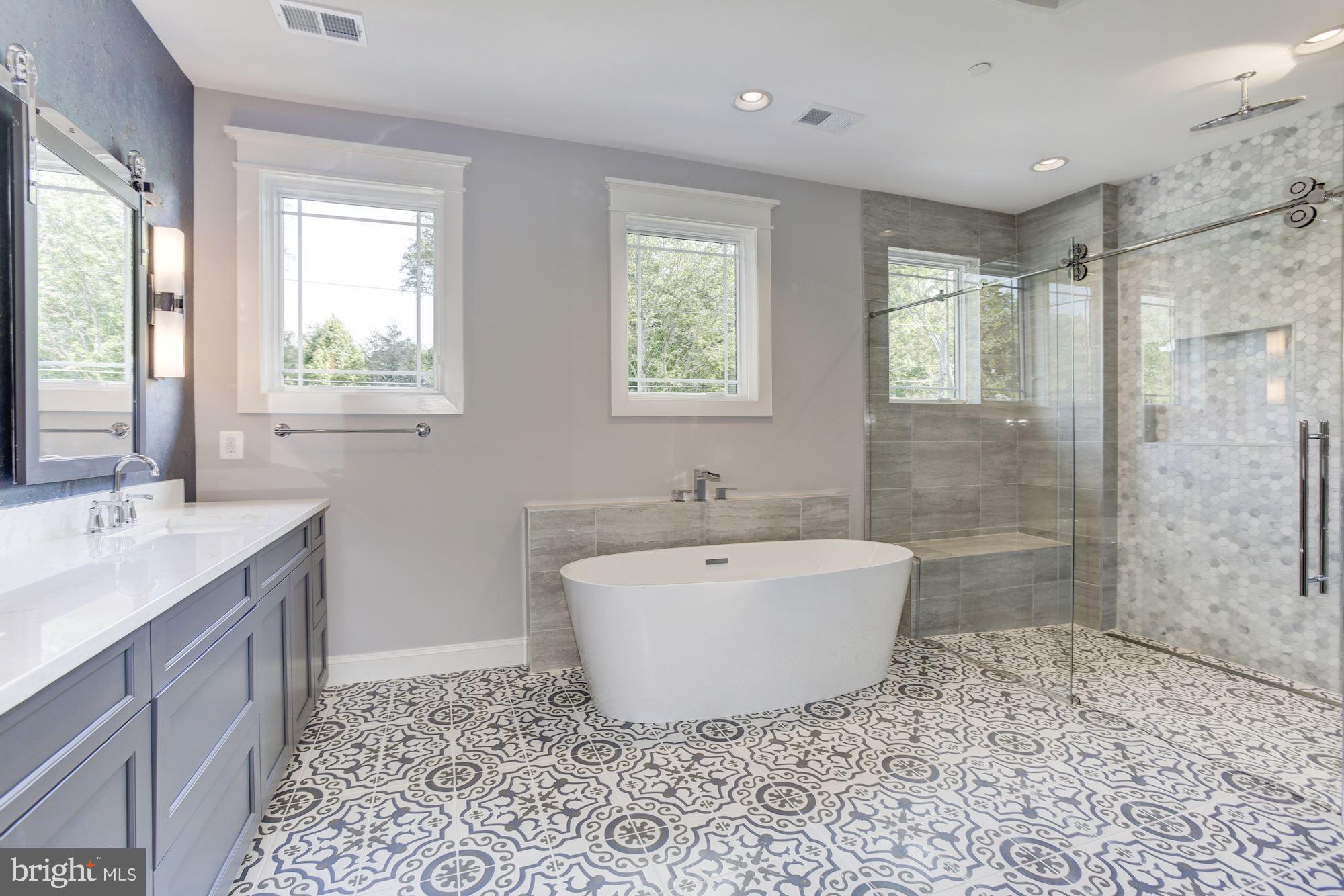 1601 Wrightson Drive McLean, VA 22101 - Photo 39 of 112 a spacious bathroom with a bathtub sink and mirror