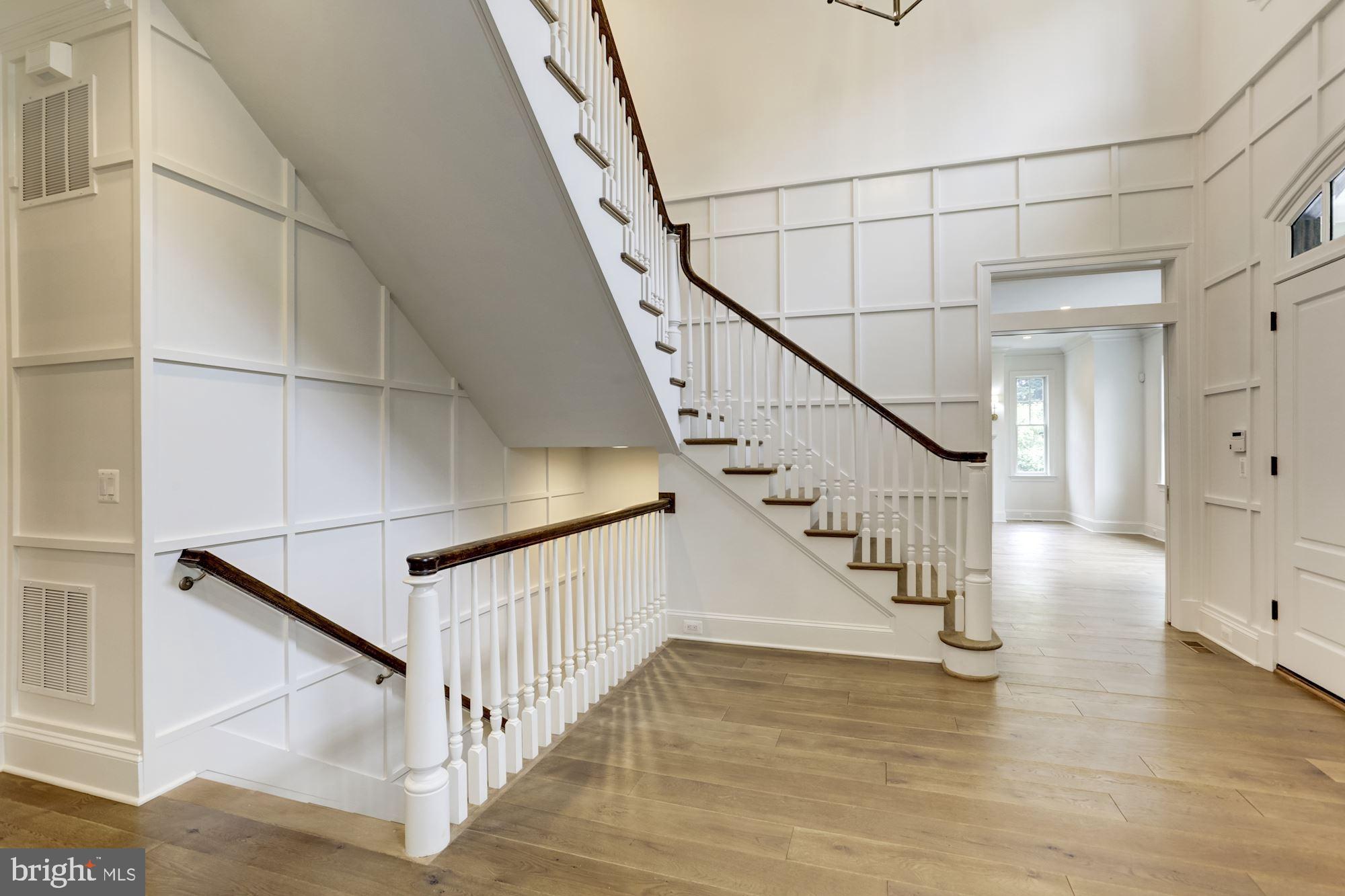 1601 Wrightson Drive McLean, VA 22101 - Photo 43 of 112 a view of staircase with white walls and a window
