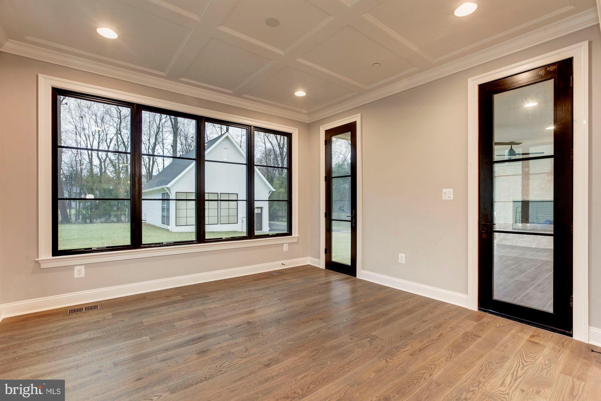 1601 Wrightson Drive McLean, VA 22101 - Photo 72 of 112 a view of an empty room with wooden floor and a window