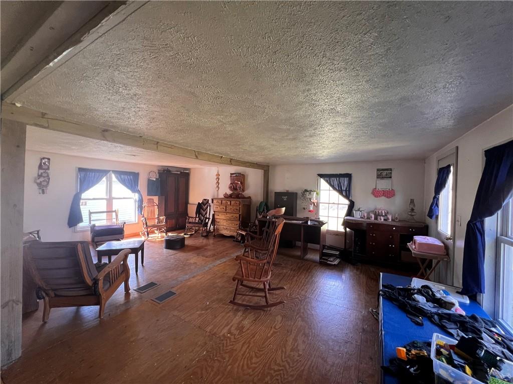 50 Rhine Run Road Russell, PA 16345 - Photo 6 of 20 a living room with furniture a window and gym equipment
