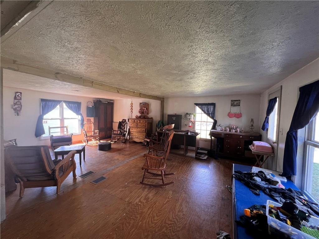 50 Rhine Run Road Russell, PA 16345 - Photo 8 of 20 a living room with furniture gym equipment and a large window