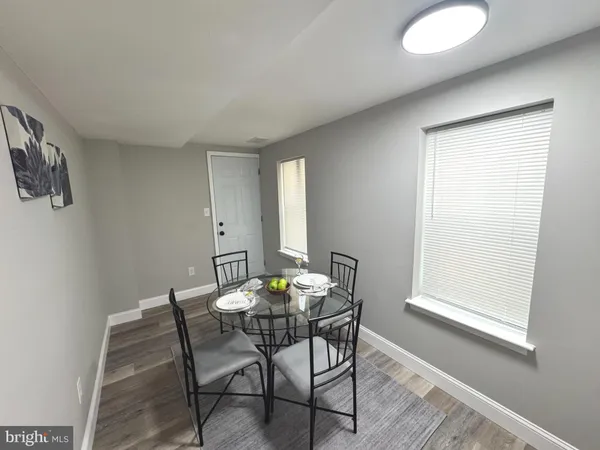 a view of a dining room with furniture and window