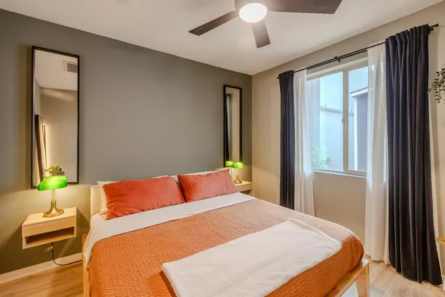 a bedroom with a bed and a couch