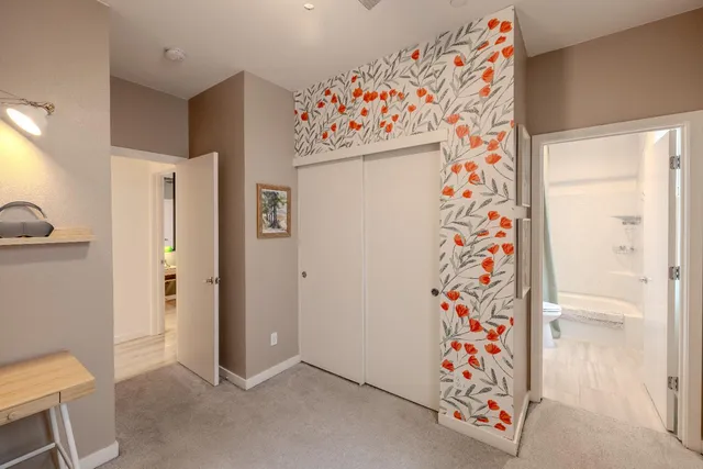 a workspace with furniture and a chandelier