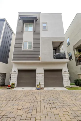 a view of a building with a yard