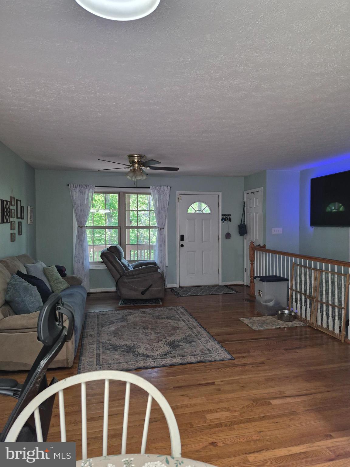 1440 Drummer Hill Road Front Royal, VA 22630 - Photo 19 of 42 a living room with furniture window and wooden floor