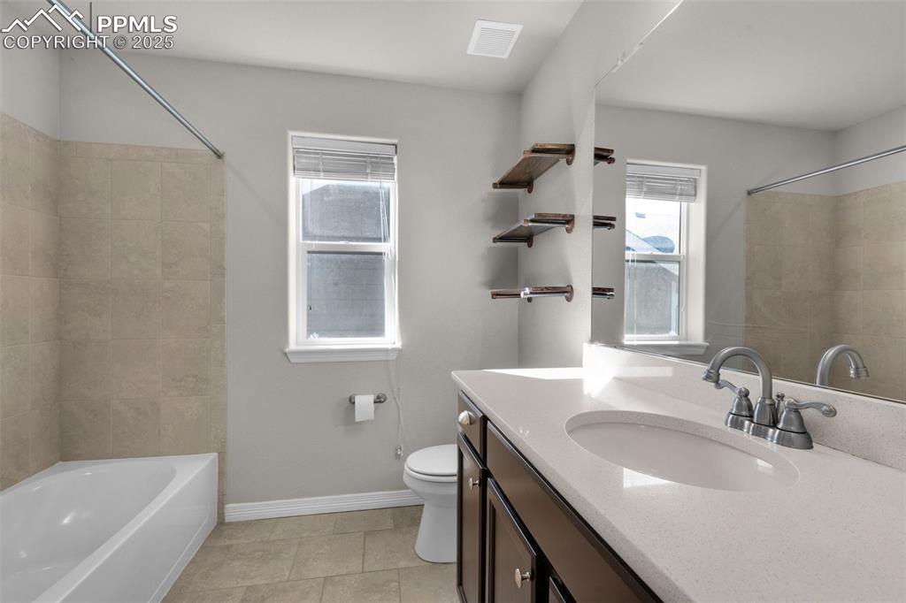 6131 Anders Ridge Lane Colorado Springs, CO 80927 - Photo 20 of 38 Full bathroom featuring vanity, shower / bathtub combination