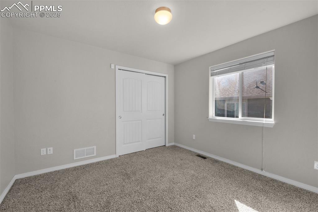 6131 Anders Ridge Lane Colorado Springs, CO 80927 - Photo 22 of 38 Secondary main level bedroom #3