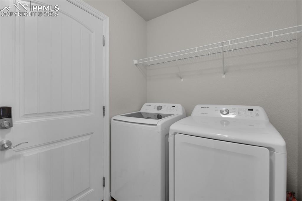 6131 Anders Ridge Lane Colorado Springs, CO 80927 - Photo 23 of 38 laundry on main level