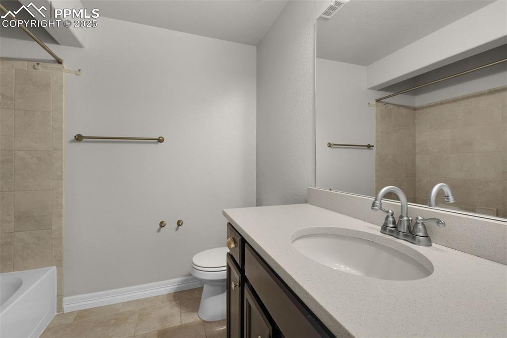 6131 Anders Ridge Lane Colorado Springs, CO 80927 - Photo 31 of 38 Full bathroom with vanity, shower / tub combination