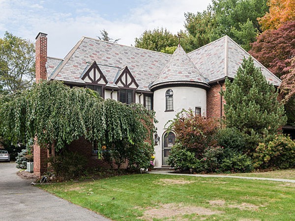 a front view of a house with garden