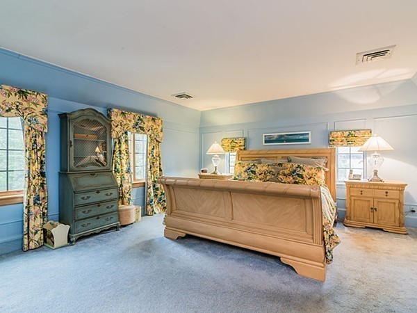 143 Upland Road Newton, MA 02468 - Photo 12 of 21 a bed room with a bed and a chair