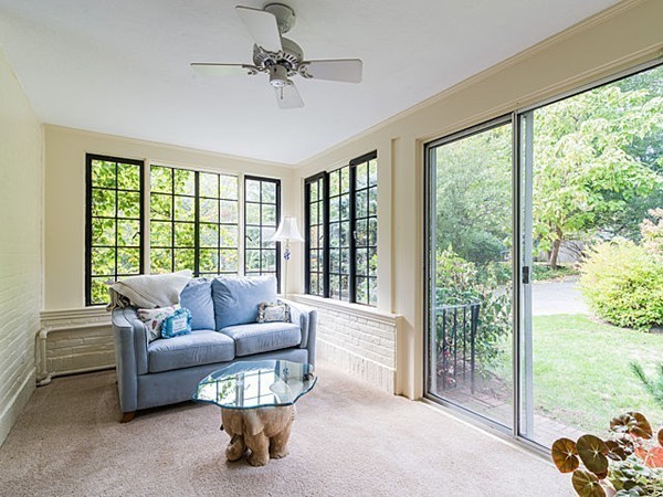143 Upland Road Newton, MA 02468 - Photo 9 of 21 a living room with furniture and a floor to ceiling window