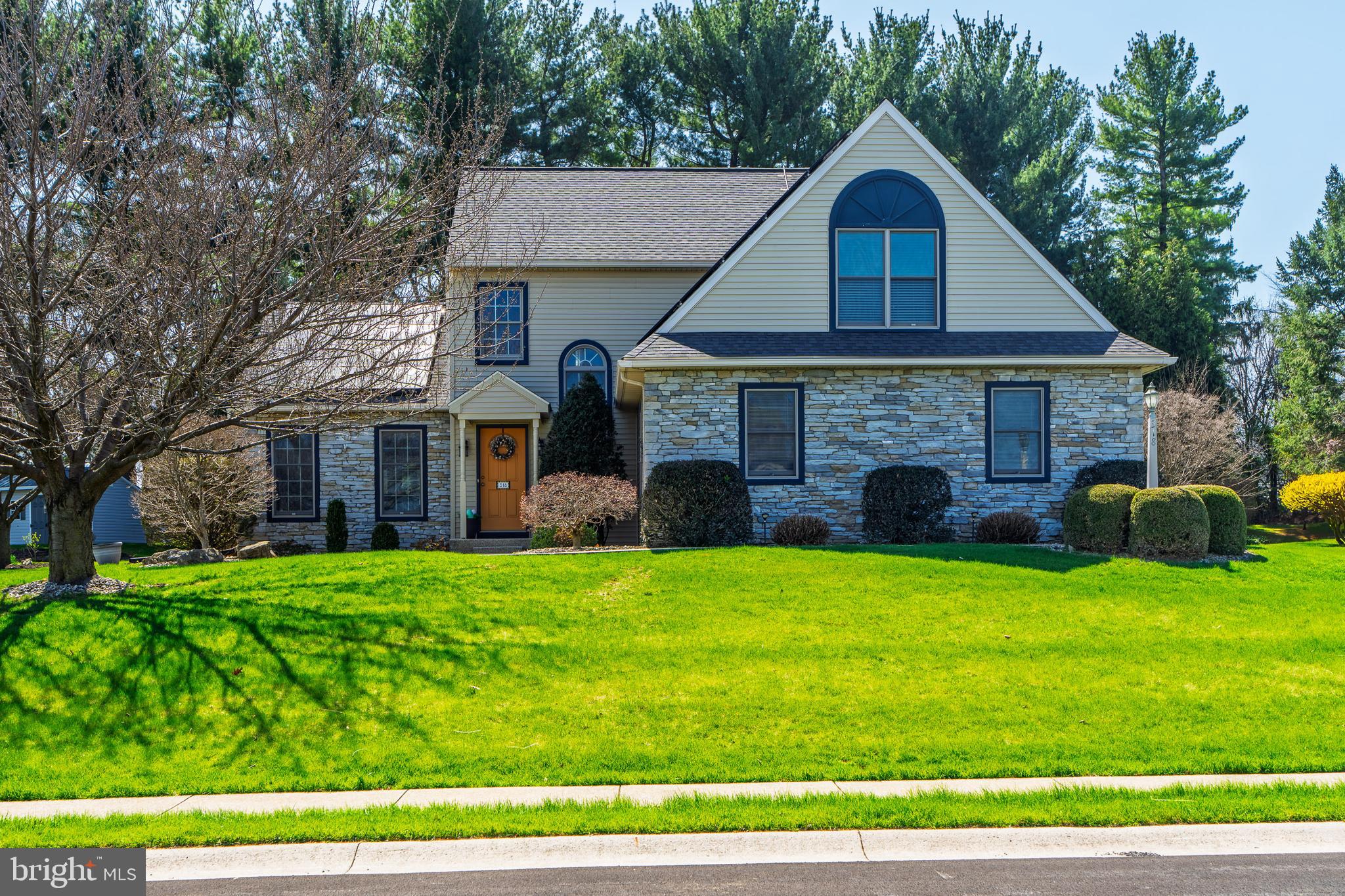 318 Portland Place Lititz, PA 17543 - Photo 1 of 39 a front view of a house with a yard