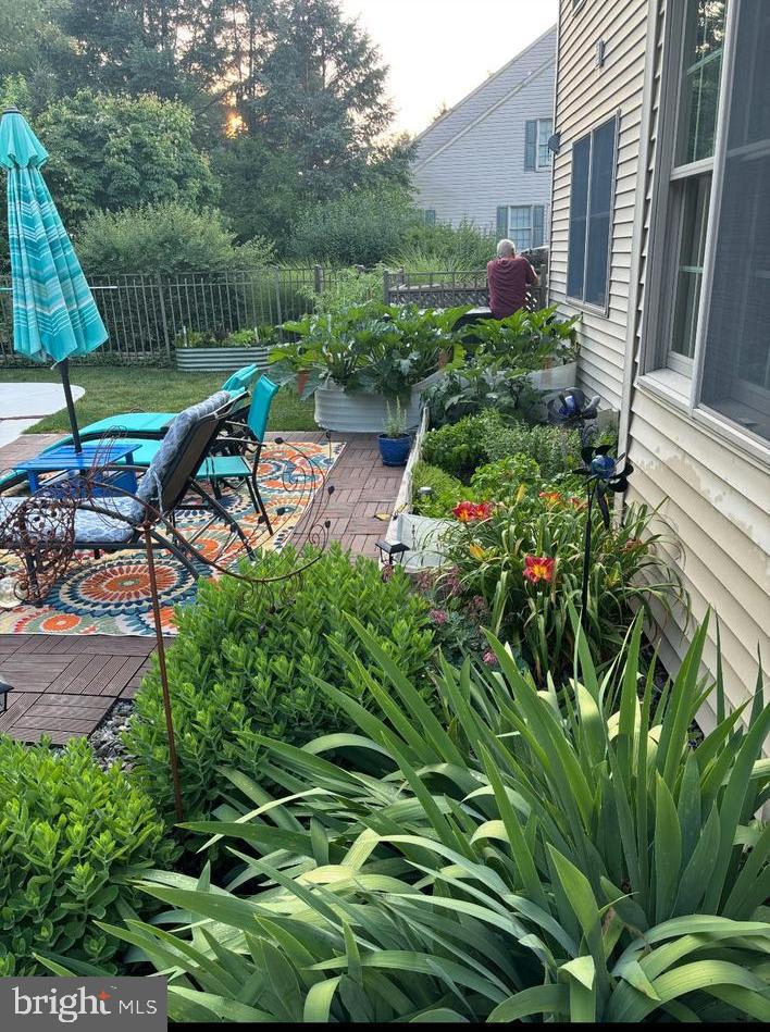 318 Portland Place Lititz, PA 17543 - Photo 9 of 39 a view of a garden with plants and a bench