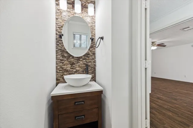 a bathroom with a sink and a mirror