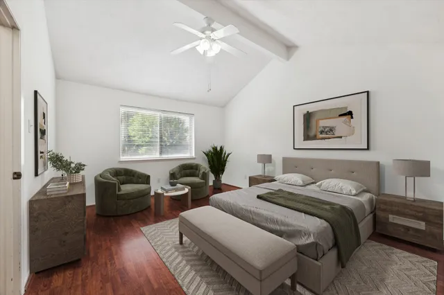 a bedroom with a balcony a bed and a couch