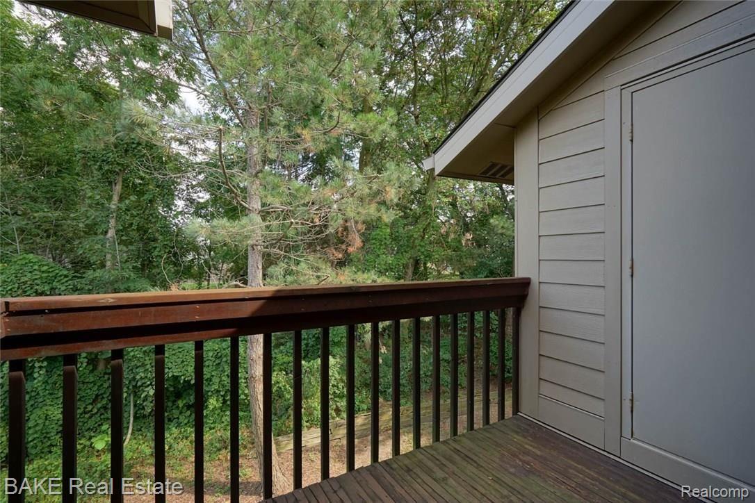 11845 Sycamore Road, Unit 39 Plymouth, MI 48170 - Photo 15 of 26 Private Deck with Wooded Views