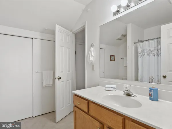 a bathroom with a sink double vanity and a mirror