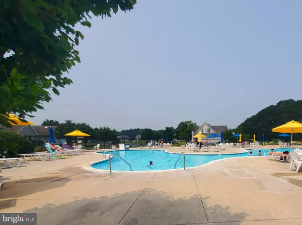 a view of a park with swings and slides