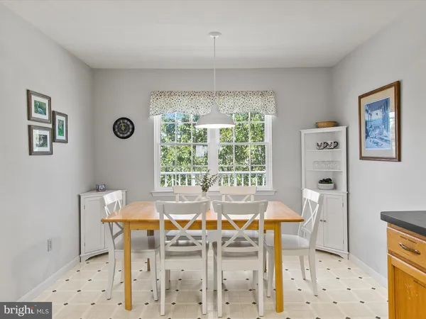 a bed room with a bed mirror and a desk