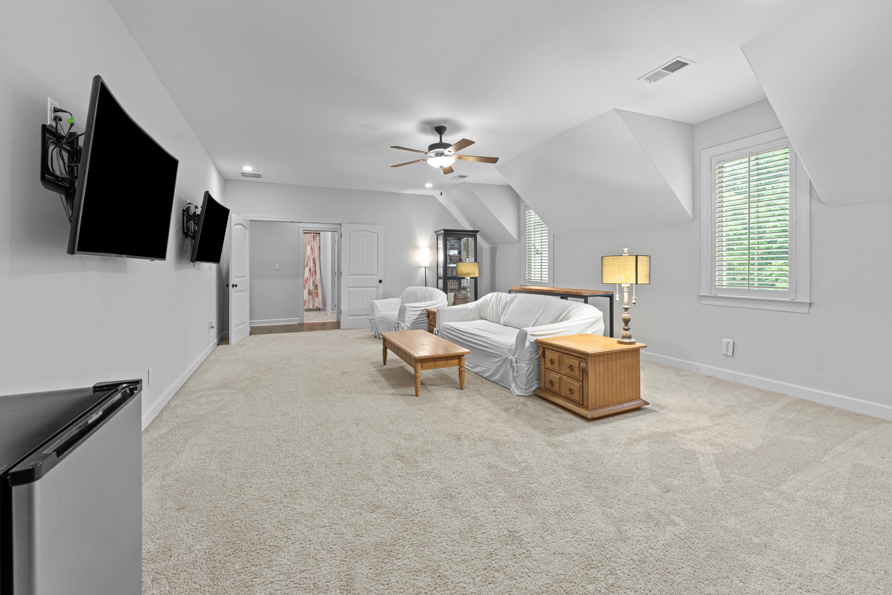 10354 Pleasant Ridge Road Arlington, TN 38002 - Photo 30 of 40 Expansive bonus space perfect for entertaining, movie nights, or just relaxing offering endless possibilities for your lifestyle needs.