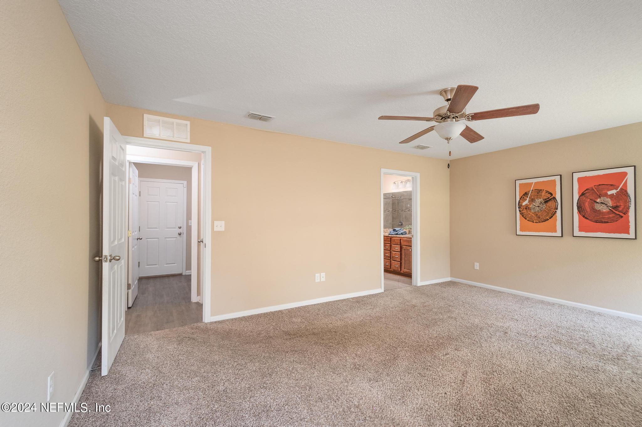 9890 Fraser Road Jacksonville, FL 32246 - Photo 11 of 23 a view of a big room with wooden floor and windows