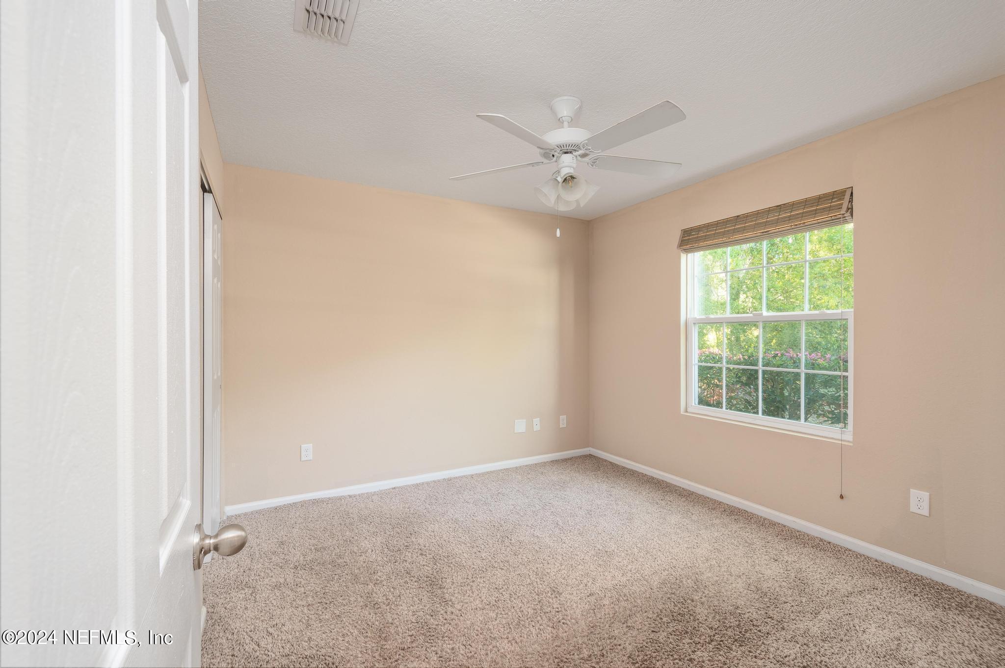 9890 Fraser Road Jacksonville, FL 32246 - Photo 14 of 23 a view of an empty room with a window