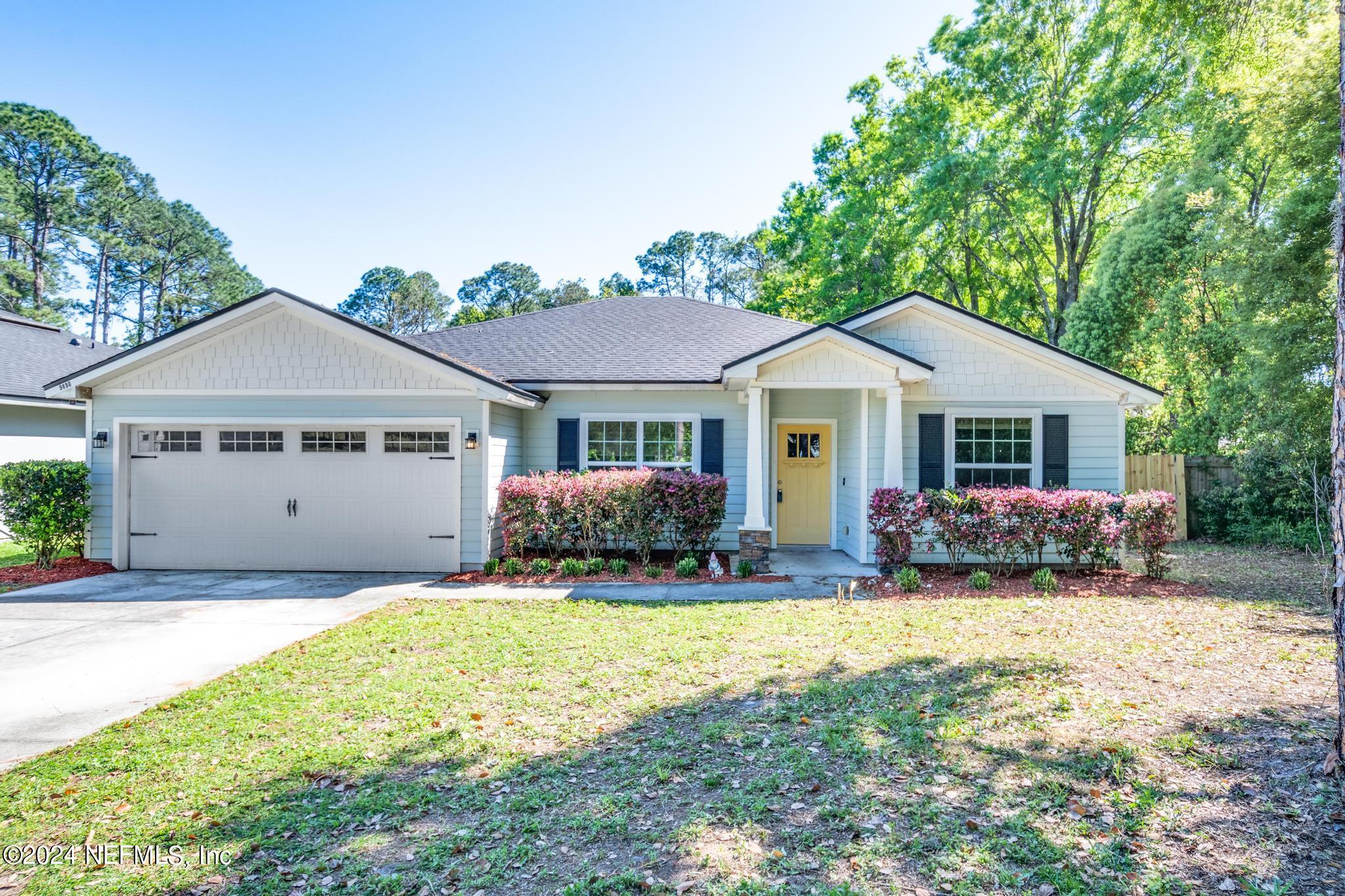 9890 Fraser Road Jacksonville, FL 32246 - Photo 2 of 23 a front view of a house with yard and porch