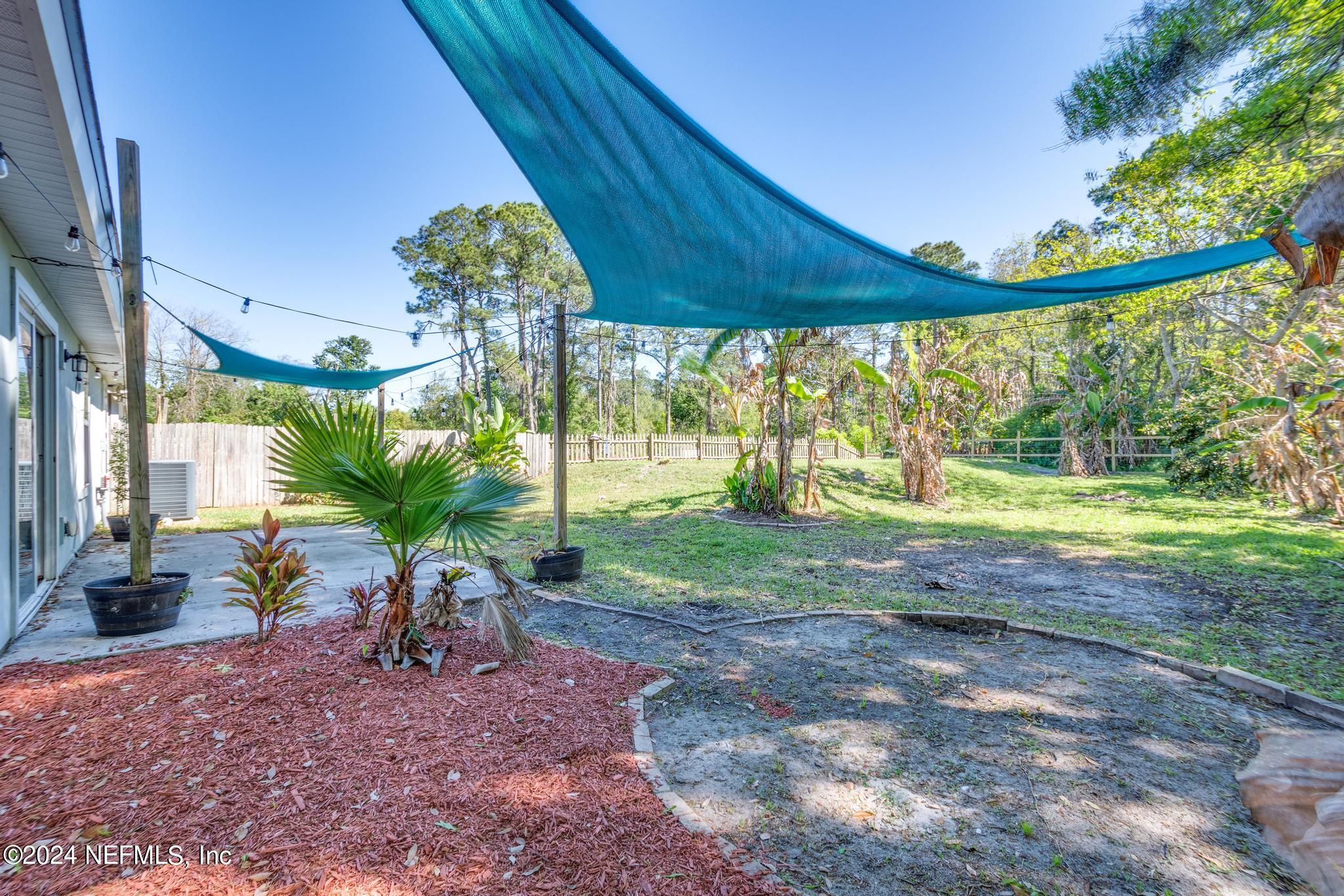 9890 Fraser Road Jacksonville, FL 32246 - Photo 22 of 23 a view of a backyard with garden