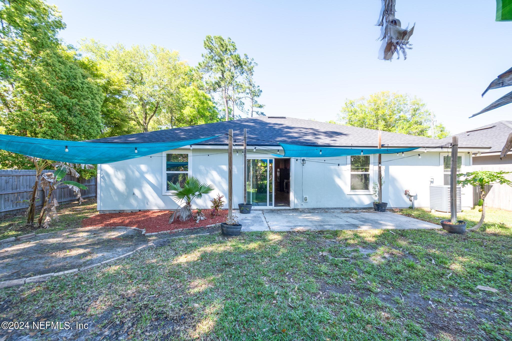 9890 Fraser Road Jacksonville, FL 32246 - Photo 23 of 23 a view of a house with a yard patio and fire pit