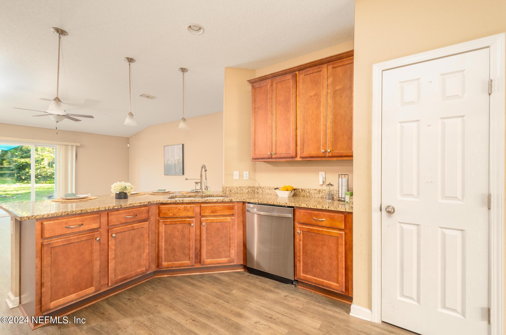 9890 Fraser Road Jacksonville, FL 32246 - Photo 8 of 23 a kitchen with lots of counter top space and sink