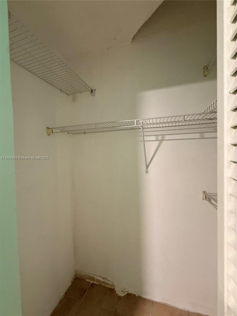 19926 Northwest 67th Place Hialeah, FL 33015 - Photo 21 of 21 a view of a room with racks on the wall