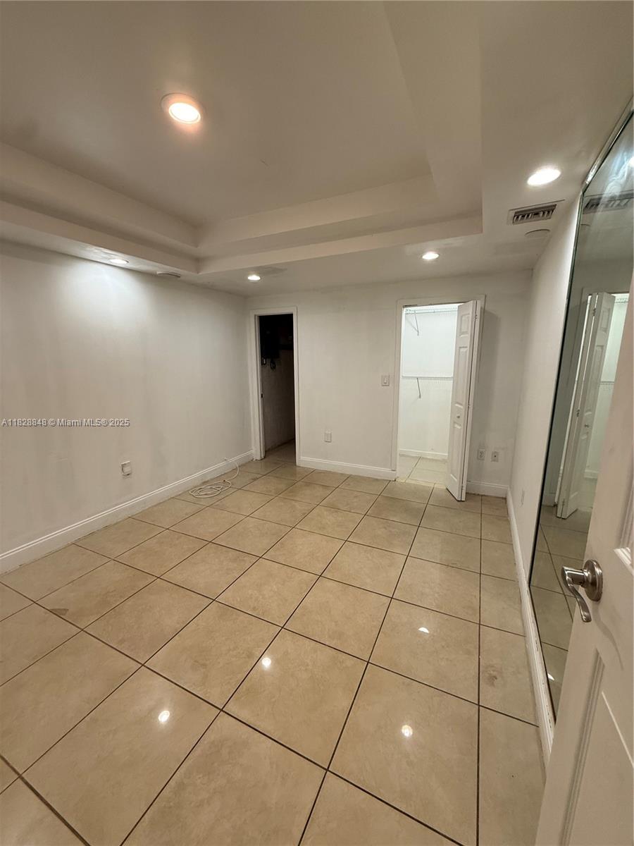 19926 Northwest 67th Place Hialeah, FL 33015 - Photo 10 of 21 a view of a livingroom with an empty space and a window