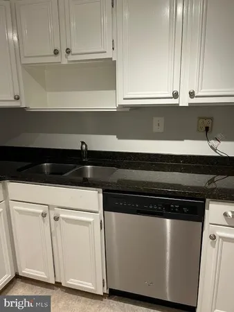 a kitchen with stainless steel appliances a refrigerator and a stove