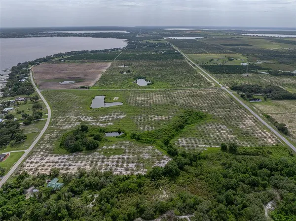 an aerial view of a residential houses with outdoor space