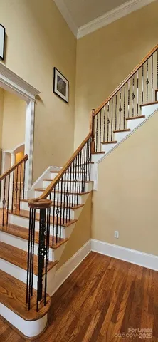 a view of livingroom with hardwood floor and a fireplace