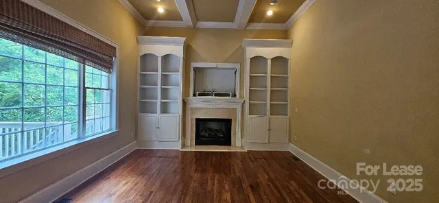 a view of an entryway with wooden floor
