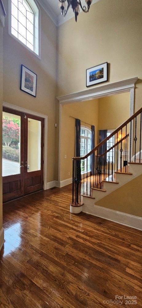 6926 Linkside Court Charlotte, NC 28277 - Photo 10 of 24 a view of empty room with stairs and wooden floor