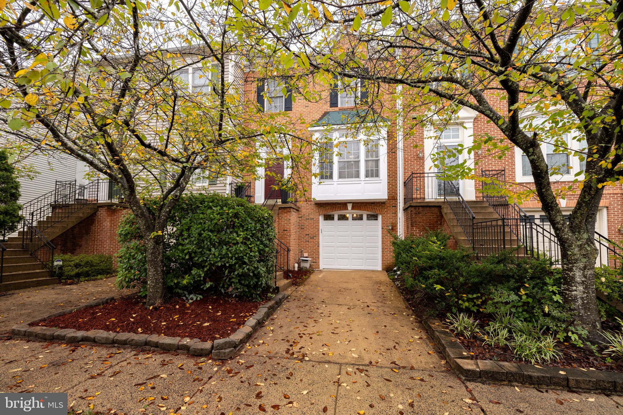 a pathway of a house with a yard