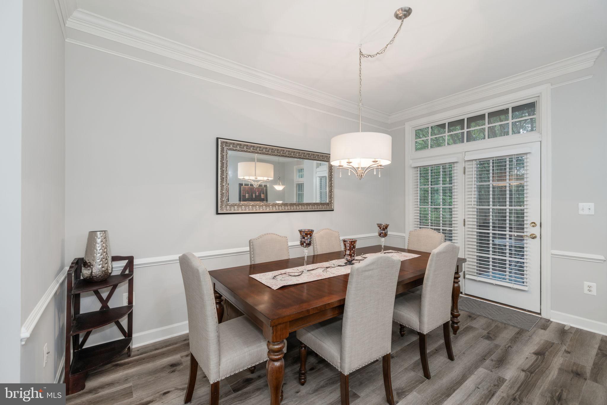 6337 Simmer Circle Springfield, VA 22150 - Photo 19 of 50 a view of a dining room with furniture window and wooden floor